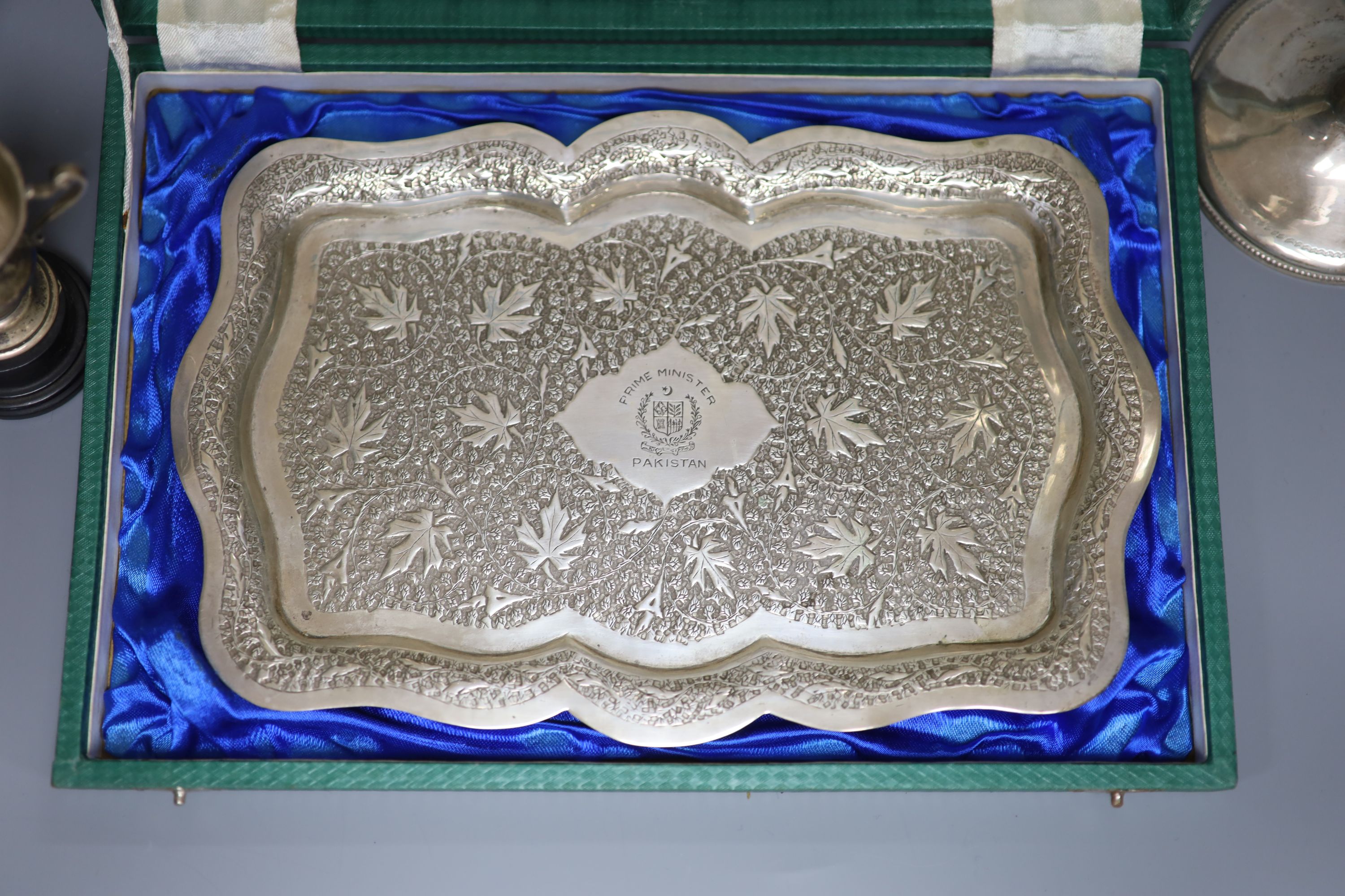 A Victorian engraved silver trophy cup, 'Twelve Hours Road Race', 1895, two small silver trophy cups and an embossed white metal presentation tray